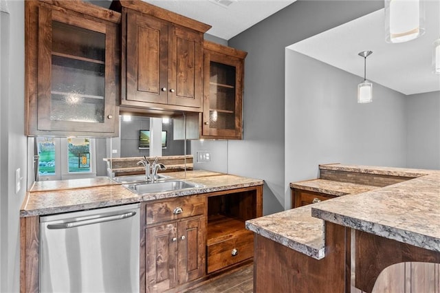 kitchen with pendant lighting, dishwasher, dark hardwood / wood-style floors, and sink