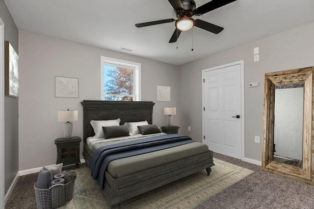 carpeted bedroom featuring ceiling fan, visible vents, and baseboards