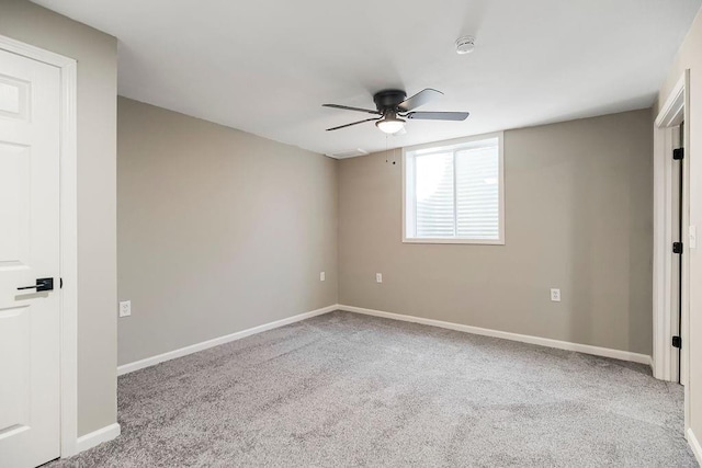 unfurnished bedroom featuring carpet floors, ceiling fan, and baseboards