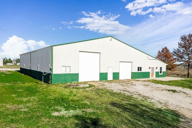 view of pole building with a lawn