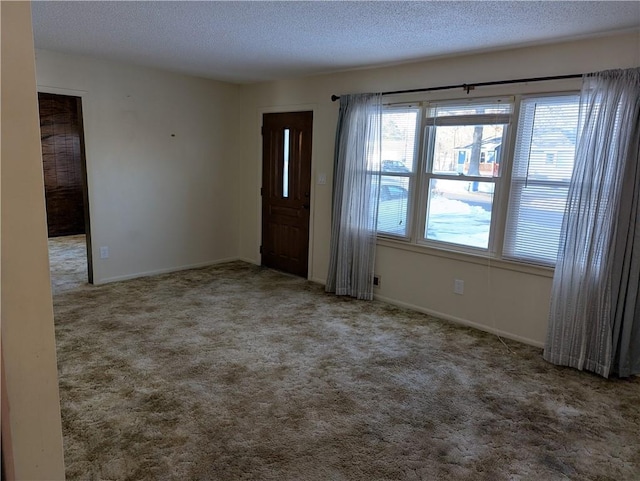 interior space featuring a textured ceiling