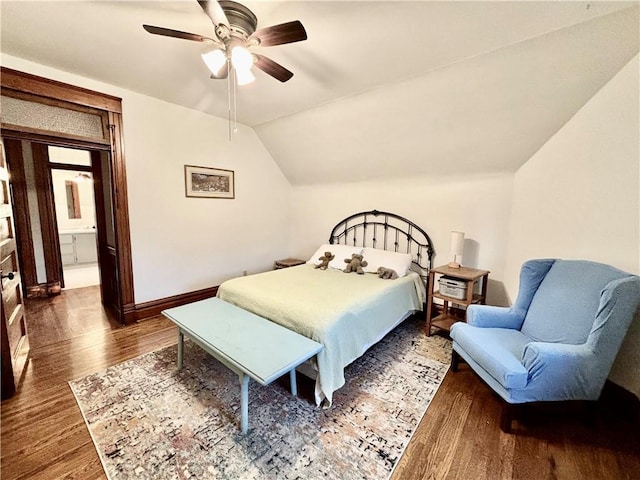 bedroom featuring ceiling fan, dark hardwood / wood-style floors, and vaulted ceiling