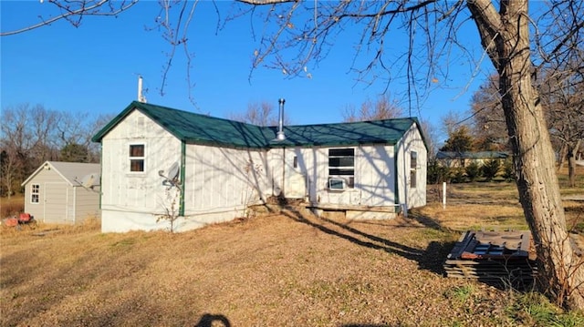 view of front of home with a storage unit