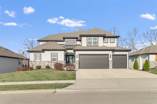 prairie-style home featuring a garage and a front yard