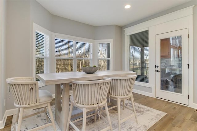 dining room with hardwood / wood-style floors