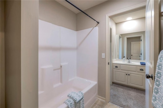 bathroom featuring vanity and  shower combination