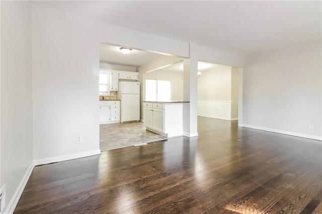 spare room featuring dark hardwood / wood-style floors