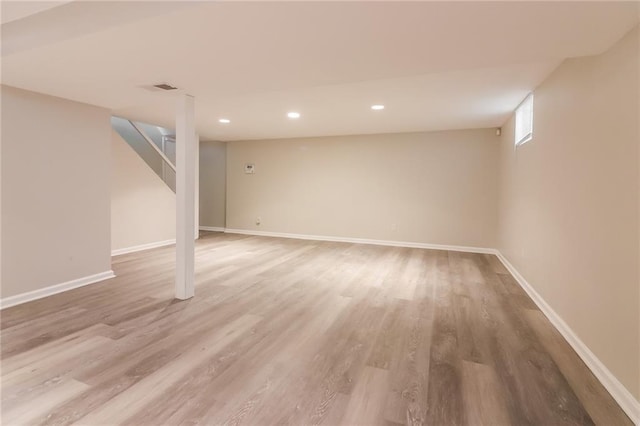 basement featuring hardwood / wood-style flooring