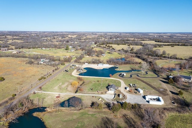 drone / aerial view featuring a rural view and a water view