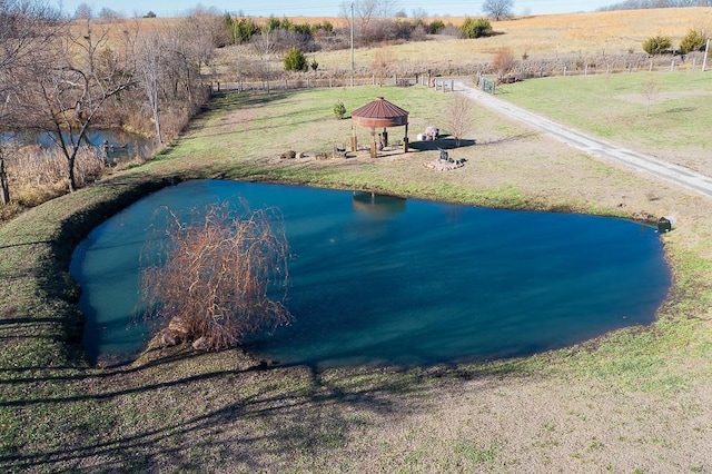 birds eye view of property with a rural view and a water view