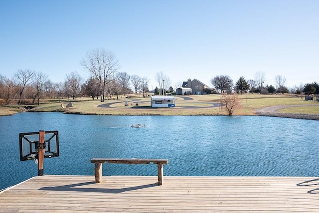 dock area featuring a yard and a water view