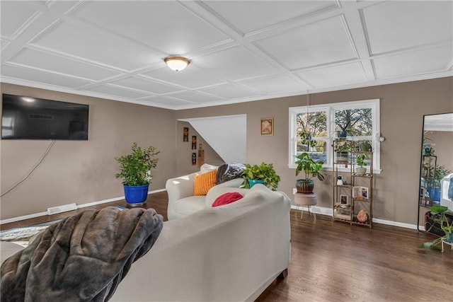 living room with coffered ceiling and dark hardwood / wood-style floors