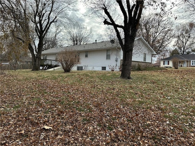 rear view of house featuring a yard and central air condition unit