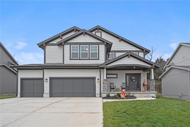 craftsman-style house with a front lawn and a garage