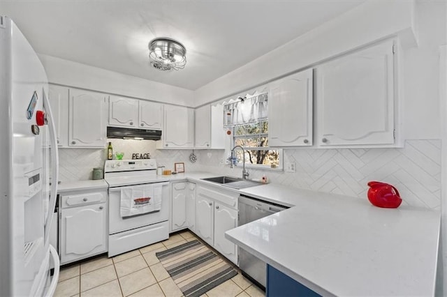 kitchen featuring white appliances, light tile patterned floors, white cabinets, under cabinet range hood, and a sink