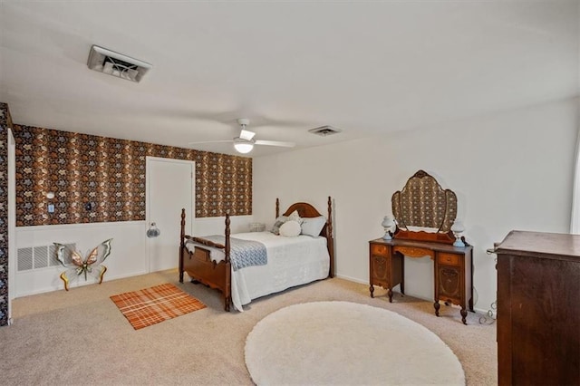 bedroom featuring ceiling fan, visible vents, and carpet flooring