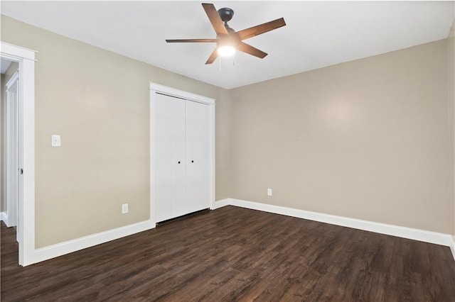 unfurnished bedroom featuring a closet, ceiling fan, and dark wood-type flooring