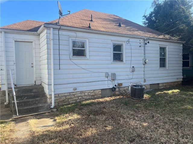 back of property with central AC unit