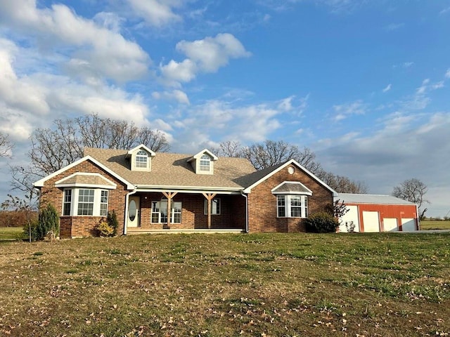 view of front of property featuring a garage and a front lawn