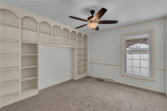 unfurnished bedroom with ceiling fan and carpet