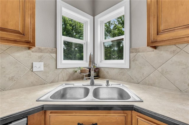 kitchen featuring decorative backsplash and sink