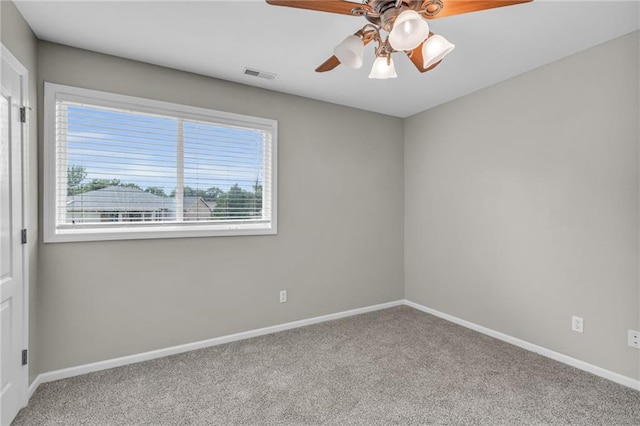 carpeted empty room with ceiling fan