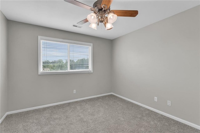 unfurnished room with ceiling fan and carpet floors