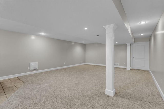 basement featuring light colored carpet