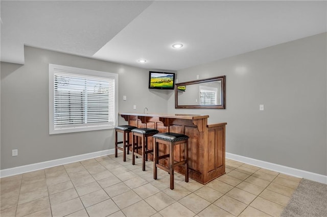 bar with light tile patterned floors