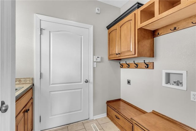 mudroom with light tile patterned floors