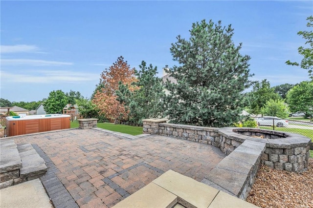 view of patio / terrace featuring a hot tub