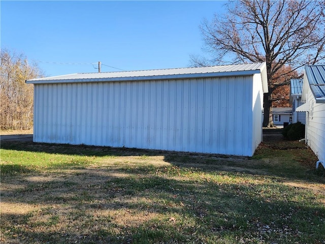 view of outdoor structure with a lawn