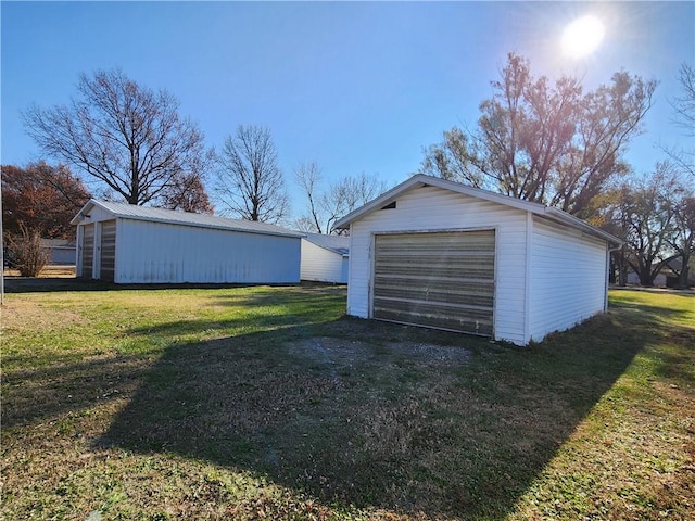 garage featuring a yard