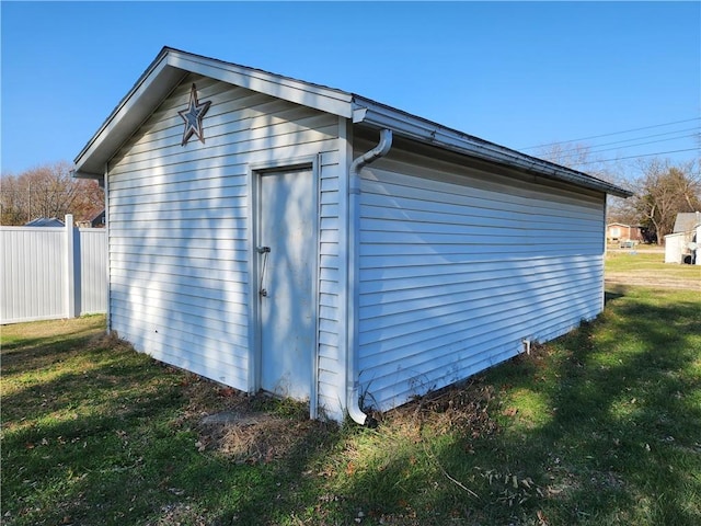 view of home's exterior featuring an outbuilding and a yard