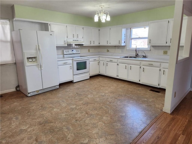 kitchen featuring white cabinetry, sink, backsplash, a notable chandelier, and white appliances