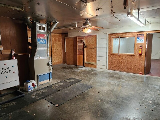 interior space featuring ceiling fan