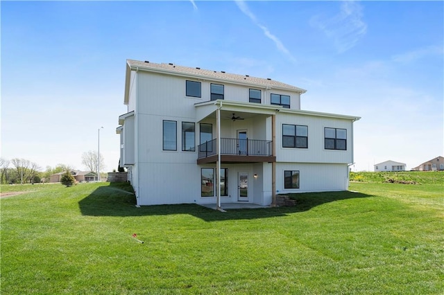 1516 NW 106th St, Kansas City, MO 64155 - back of house featuring ceiling fan, a balcony, and a yard