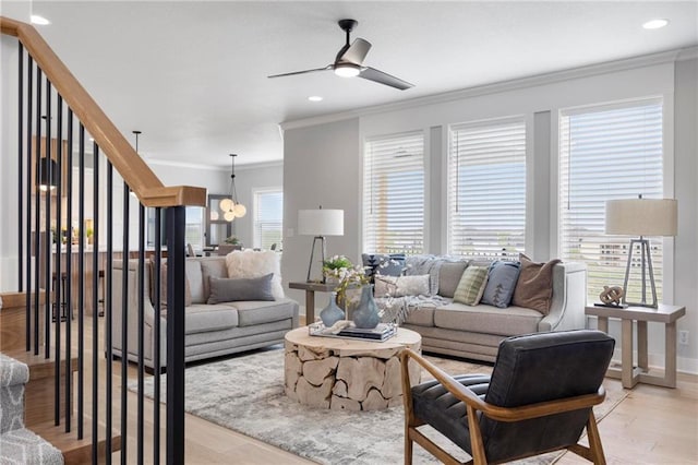 1516 NW 106th St, Kansas City, MO 64155 - living area with recessed lighting, light wood finished floors, ornamental molding, baseboards, and ceiling fan with notable chandelier
