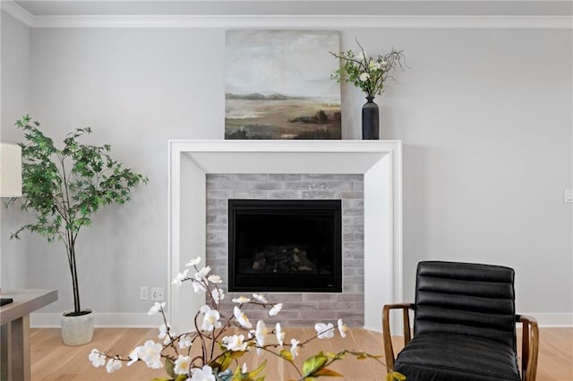 1516 NW 106th St, Kansas City, MO 64155 - interior space featuring a glass covered fireplace, wood finished floors, crown molding, and baseboards