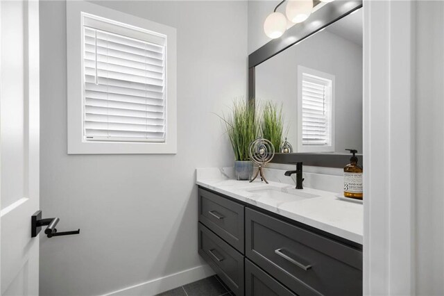 1516 NW 106th St, Kansas City, MO 64155 - bathroom featuring baseboards, vanity, and tile patterned floors