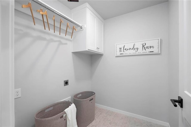 1516 NW 106th St, Kansas City, MO 64155 - laundry room with electric dryer hookup, cabinet space, and baseboards