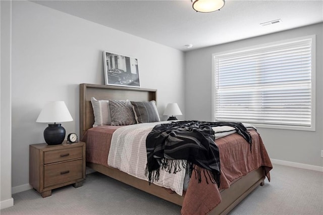 1516 NW 106th St, Kansas City, MO 64155 - bedroom featuring visible vents, light carpet, and baseboards