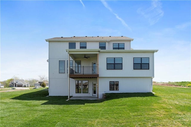 1516 NW 106th St, Kansas City, MO 64155 - back of house with a ceiling fan, a yard, and a patio