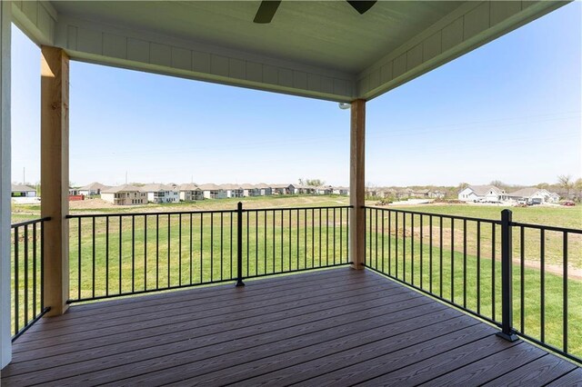1516 NW 106th St, Kansas City, MO 64155 - wooden deck featuring a lawn, a residential view, and ceiling fan
