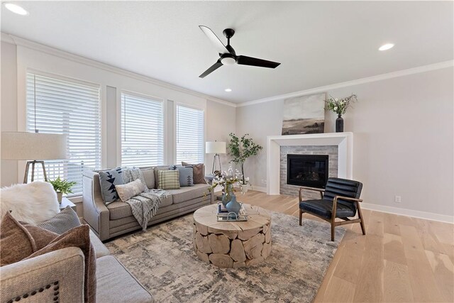 1516 NW 106th St, Kansas City, MO 64155 - living room with a wealth of natural light, crown molding, light wood finished floors, and baseboards