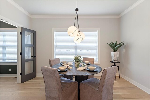 1516 NW 106th St, Kansas City, MO 64155 - dining space with light wood-style floors, a wealth of natural light, baseboards, and ornamental molding