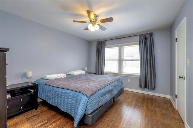 bedroom with hardwood / wood-style flooring and ceiling fan