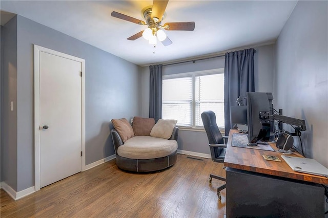 home office with ceiling fan and hardwood / wood-style floors