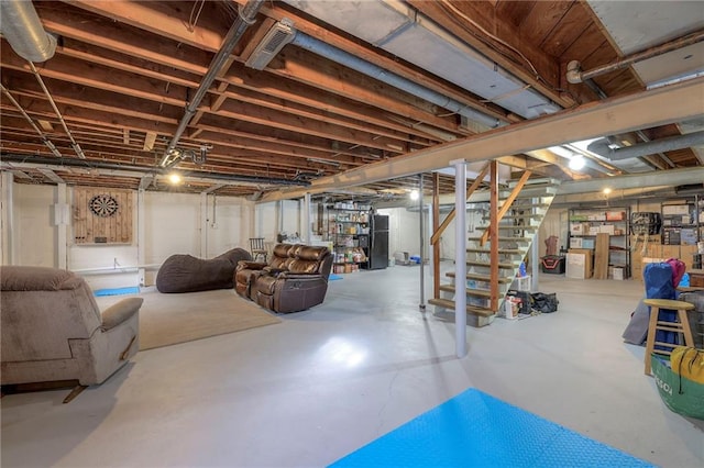 basement featuring black fridge