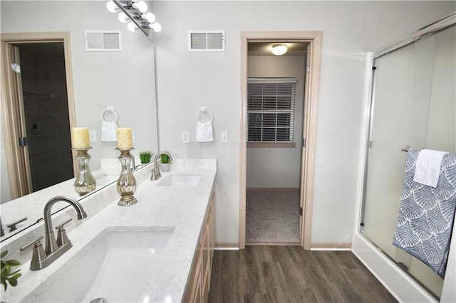 full bath featuring a stall shower, visible vents, and a sink